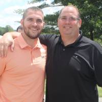 two men by golf carts